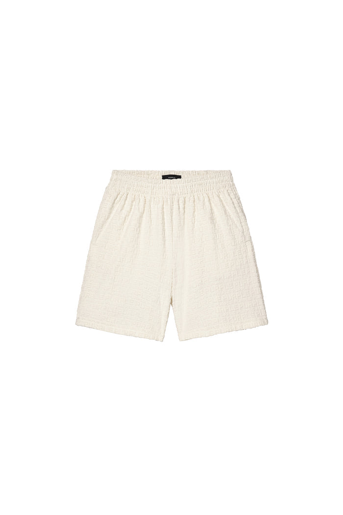 Jacquard Terry Short in white with wordmark effect, crafted from cotton and polyester.