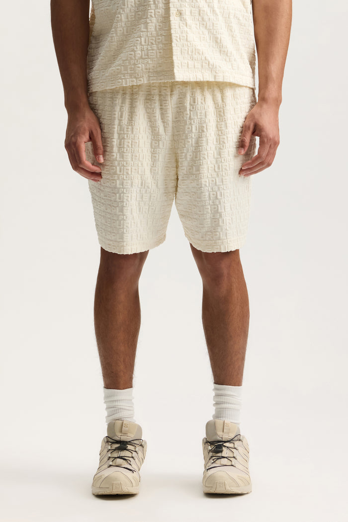 Jacquard Terry Short in white with wordmark effect, made of cotton and polyester blend.
