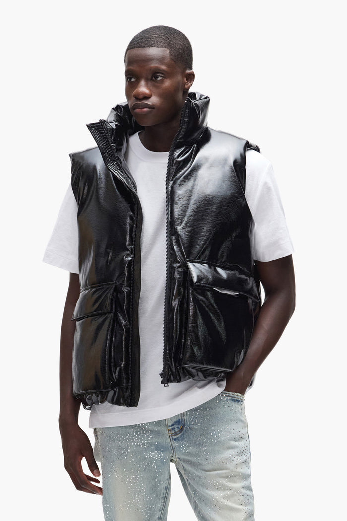 Faux leather oversized puffer vest for outerwear, made with polyurethane and down fill.