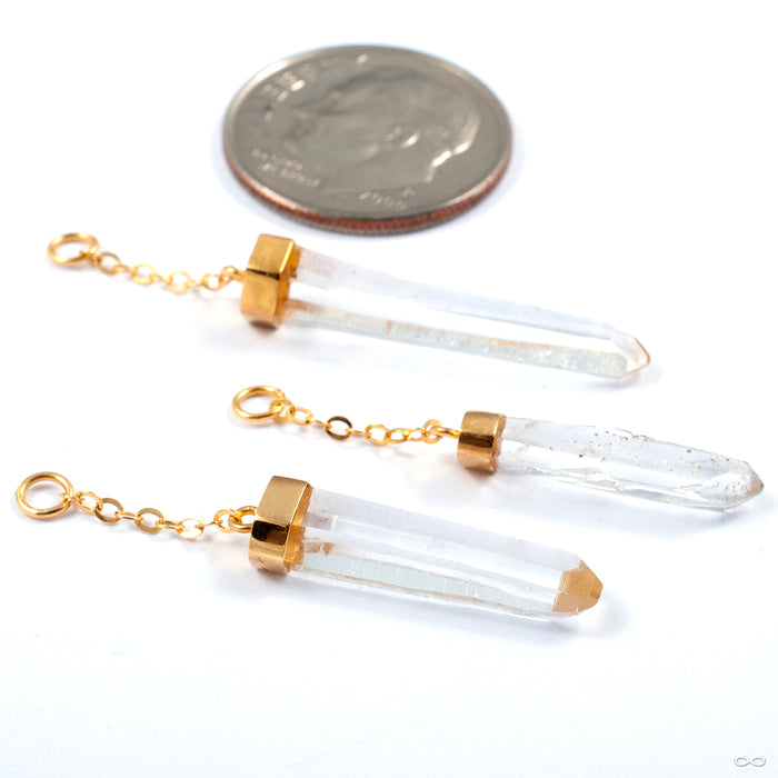 Lemurian Crystal Charm in Gold from Diablo Organics in a group