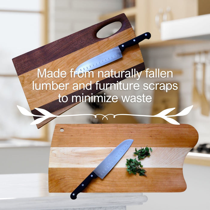Two TY Fine Furniture Mixed Wood Cutting Boards with Integrated Bowl Serving Tray Large, each paired with a chef’s knife, displayed in a kitchen. Text: Crafted from naturally fallen lumber and furniture scraps to minimize waste. One board holds chopped herbs.