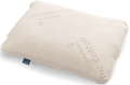 The Naturepedic Organic Adjustable Latex Pillow is a rectangular beige pillow made from organic cotton, featuring "Naturepedic" and "organic cotton" embroidery and a small blue fabric tag on the side.