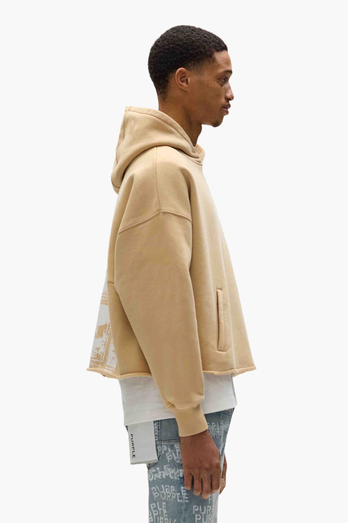 Newsprint Cropped Hoodie in beige with logo lettering and graphic on the back.