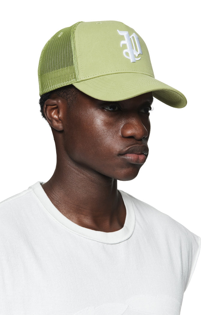 P Logo Trucker Hat in green with gothic Purple Brand monogram and curved visor design.