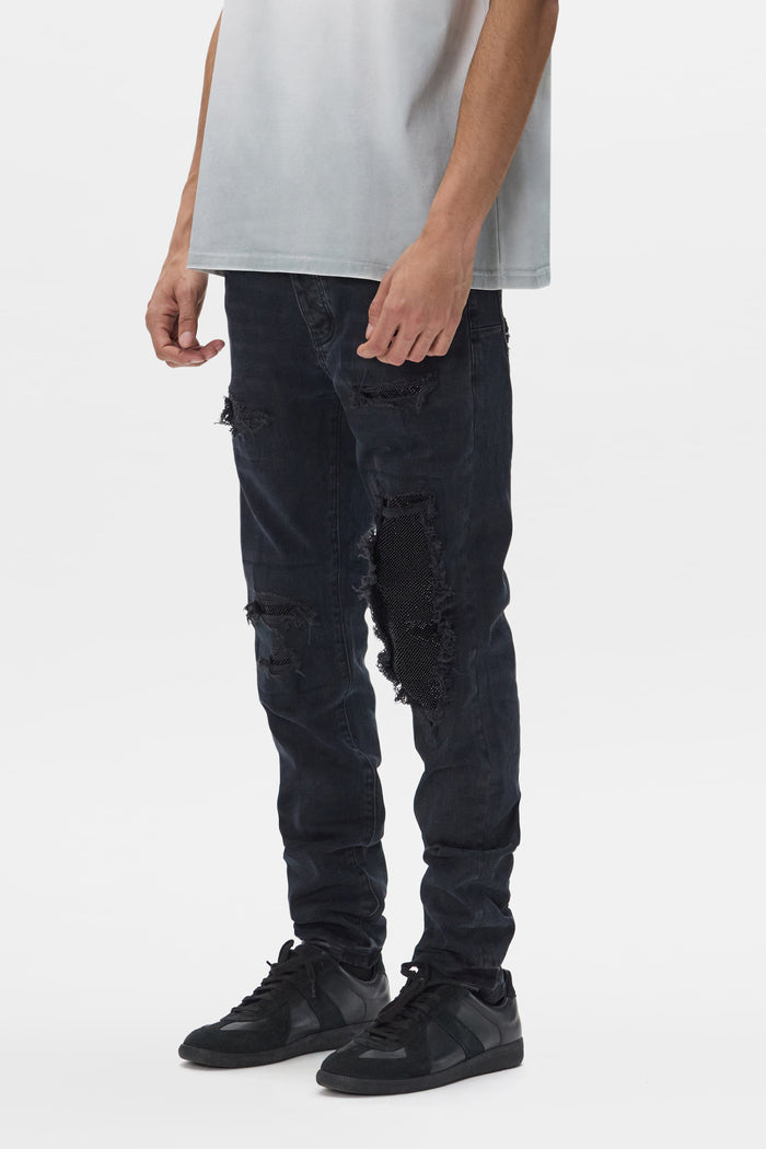 Beaded Repair Denim in black with 10 3/8" front rise and 33" inseam.
