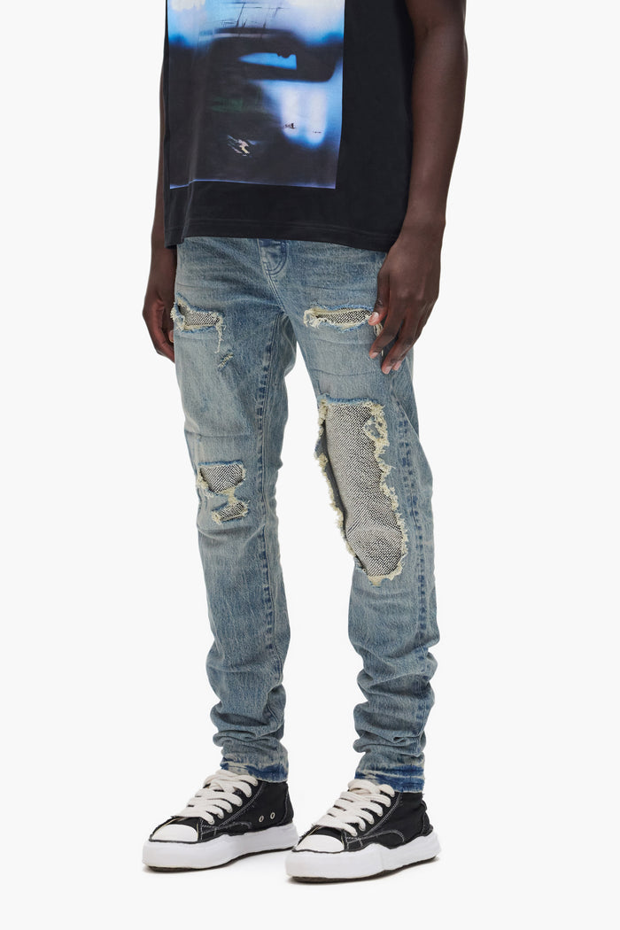 Beaded Repair low rise denim with silver beaded patches and premium stretch fabric.
