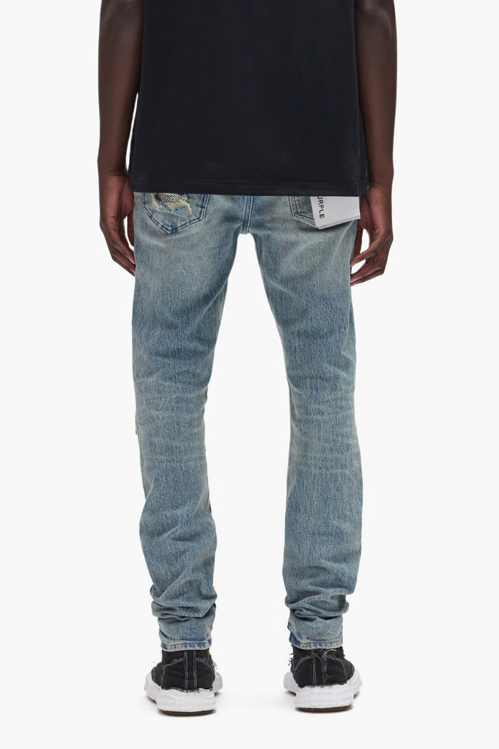 Beaded Repair low rise denim with silver beaded patches and surface abrasions, sizes 28-40