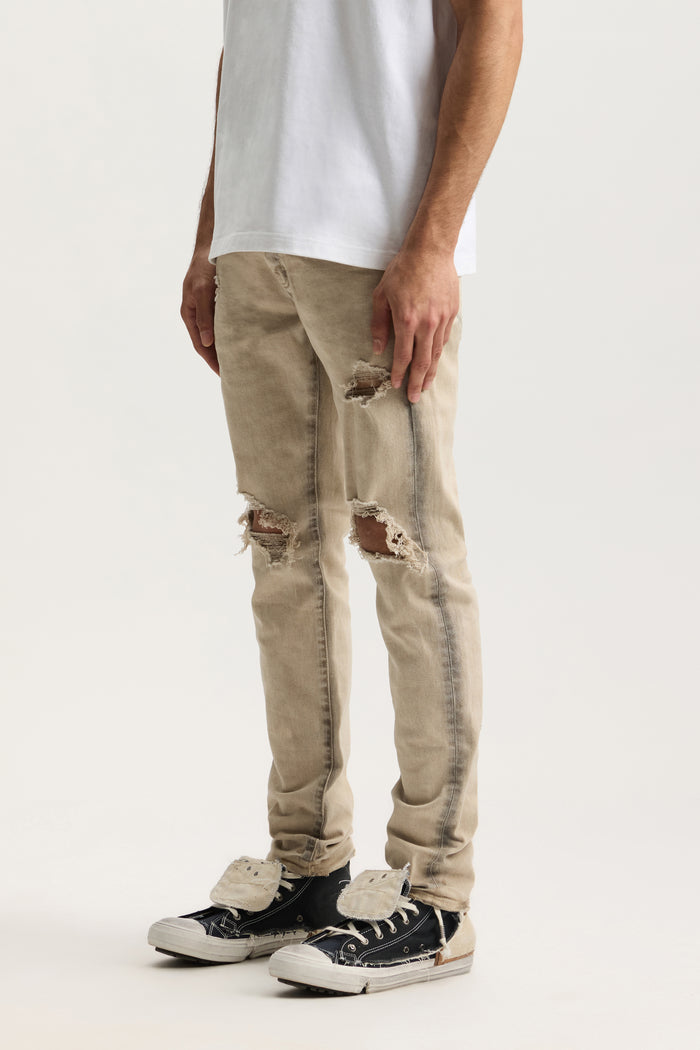 P001 Coated Seam denim, low rise, stretch skinny with front blowouts and spray-coated seams.