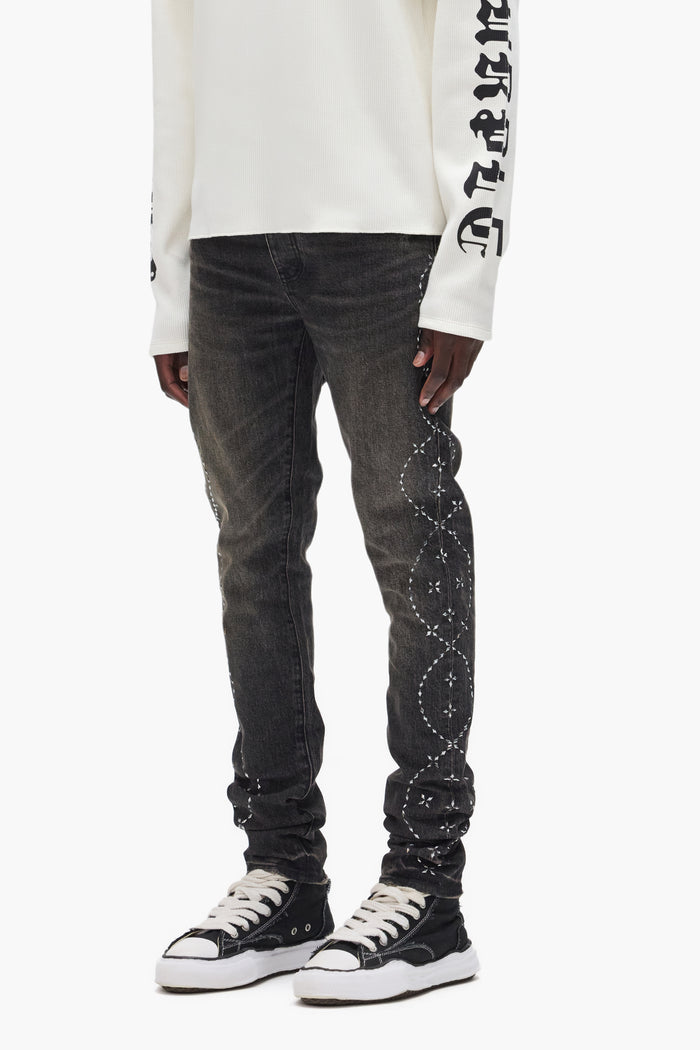 Hotfix Twist low rise denim with side seam crystals and signature purple hangtag.