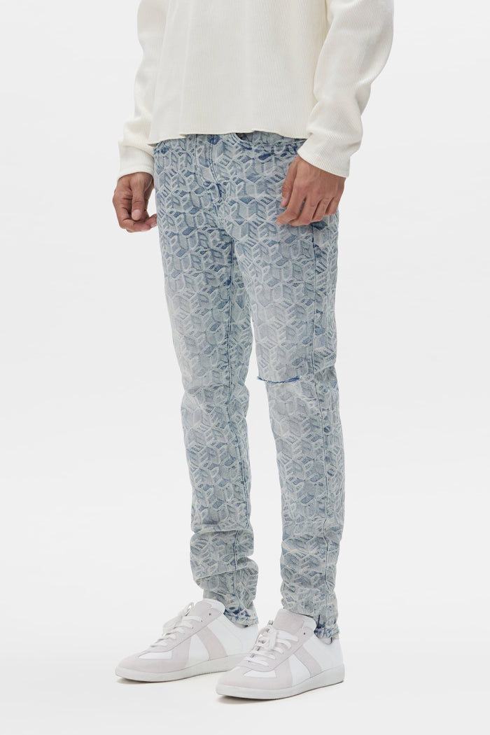 Jacquard Monogram denim stretch skinny jeans with low rise, sizes 28 to 40, unique wash finish.