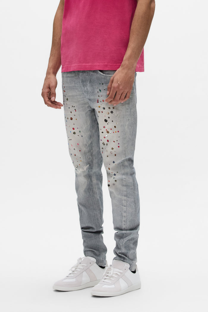 Stretch skinny denim jeans with hotfix and digital printed jewels, available in various sizes.