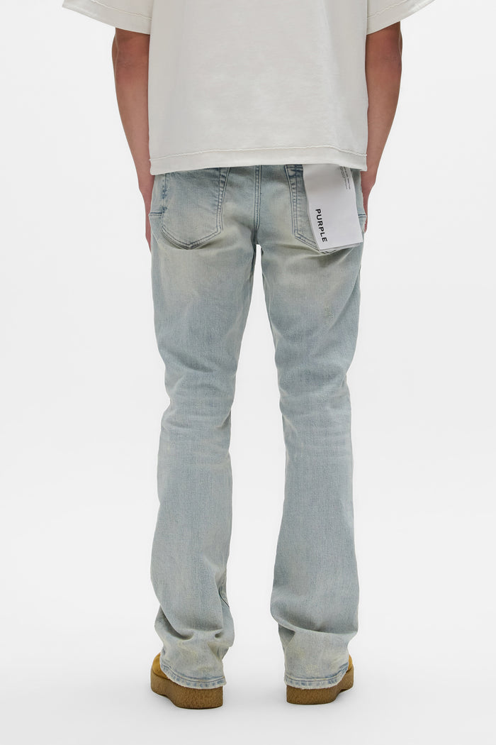 Slim fit white denim jeans with flared leg and knee blowouts, available in sizes 28-40.