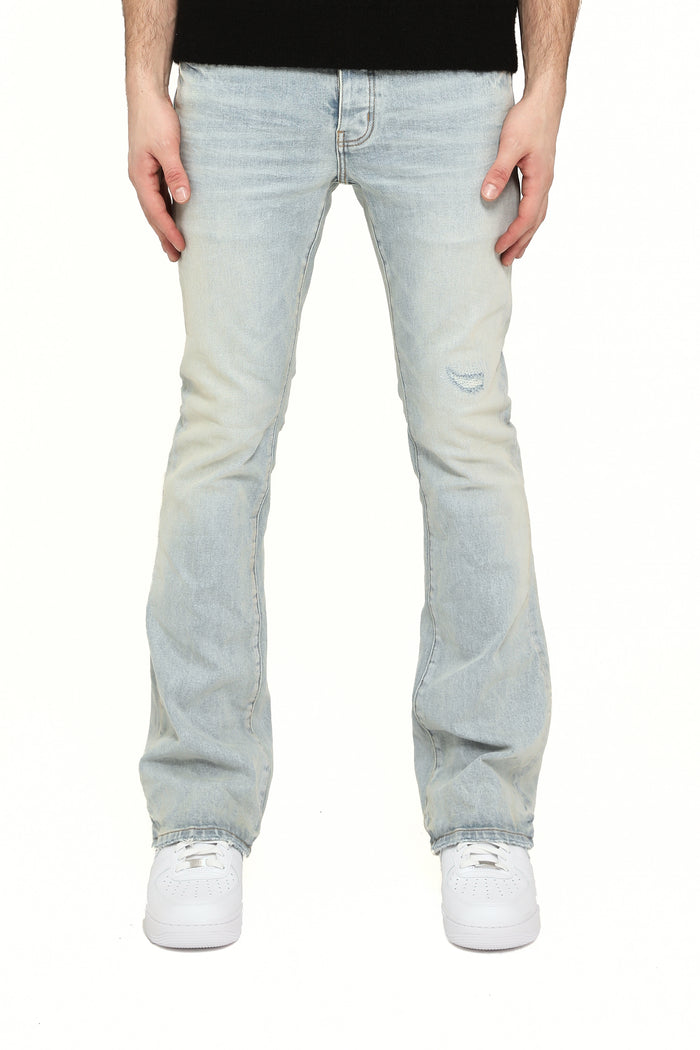 Slim fit distressed jeans with flared leg and low rise, part of the WHITE LABEL collection.