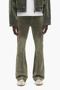 Flock Dipped Denim in green with low rise, slim fit and flared leg, available in multiple sizes.