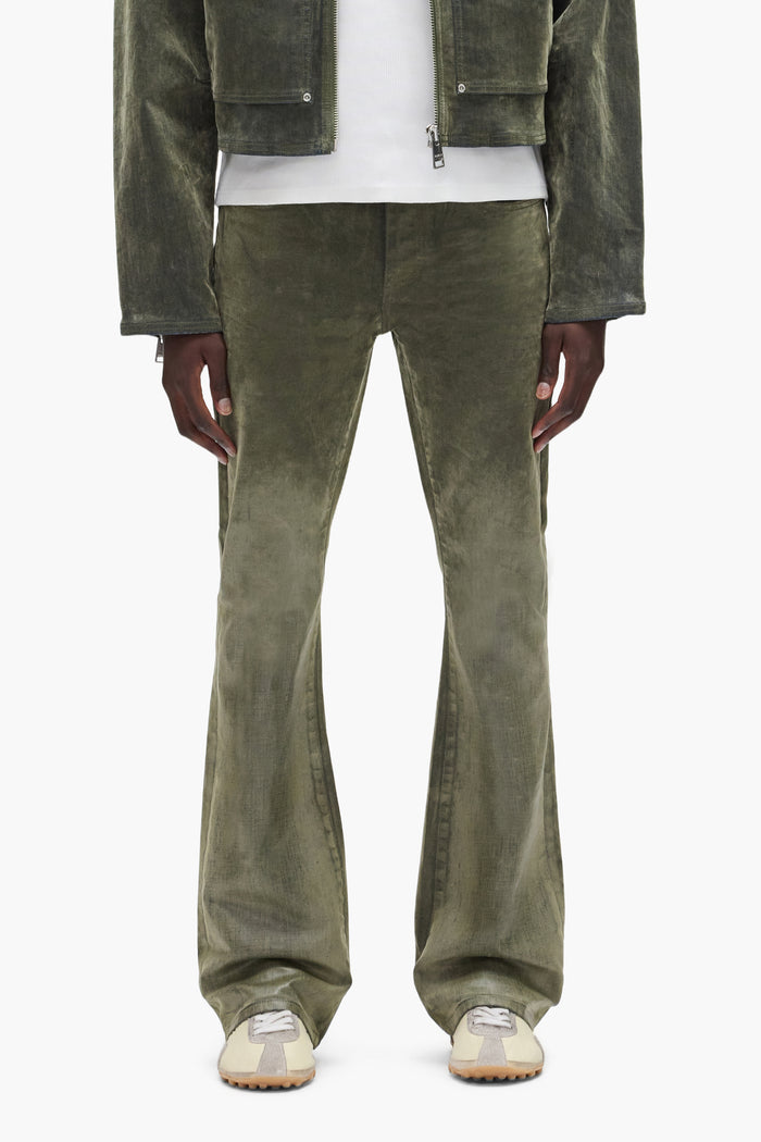 Flock Dipped Denim in green with low rise, slim fit and flared leg, available in multiple sizes.