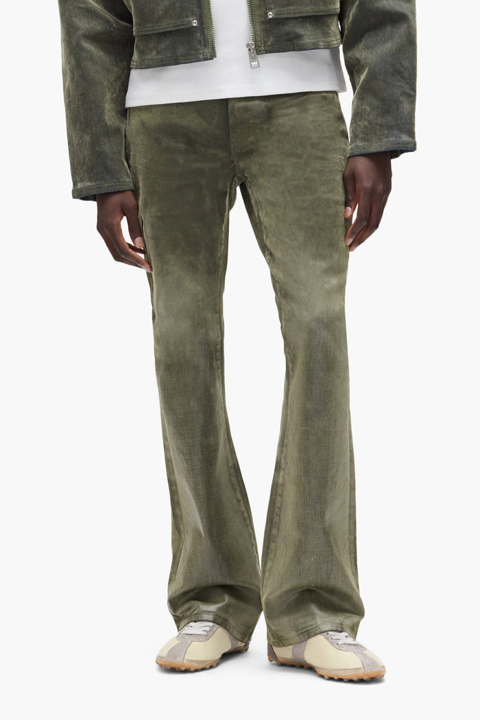 Flock Dipped denim, low rise slim fit with flared leg, sizes 28 to 40, unique fall winter 2025 design.
