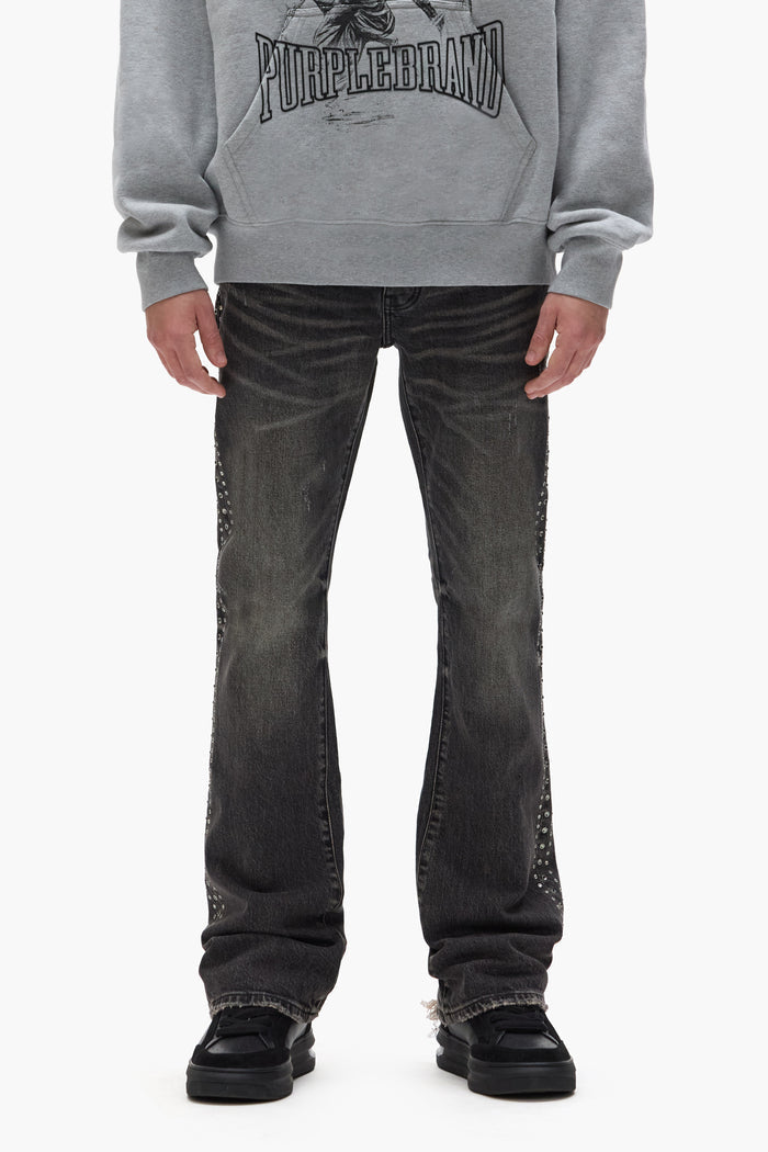 P004 Side Crystal faded low rise boot-cut denim with crystals along the seams and chewed hem.