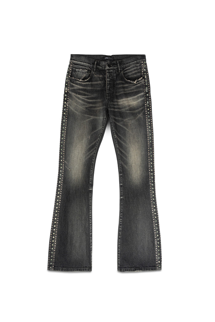 Faded low rise boot-cut denim with side crystals and chewed hem in vintage dirty black wash.