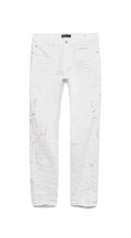 Zola Blanco distressed slim-fit washed white denim jeans with purple hangtag and leather patch.