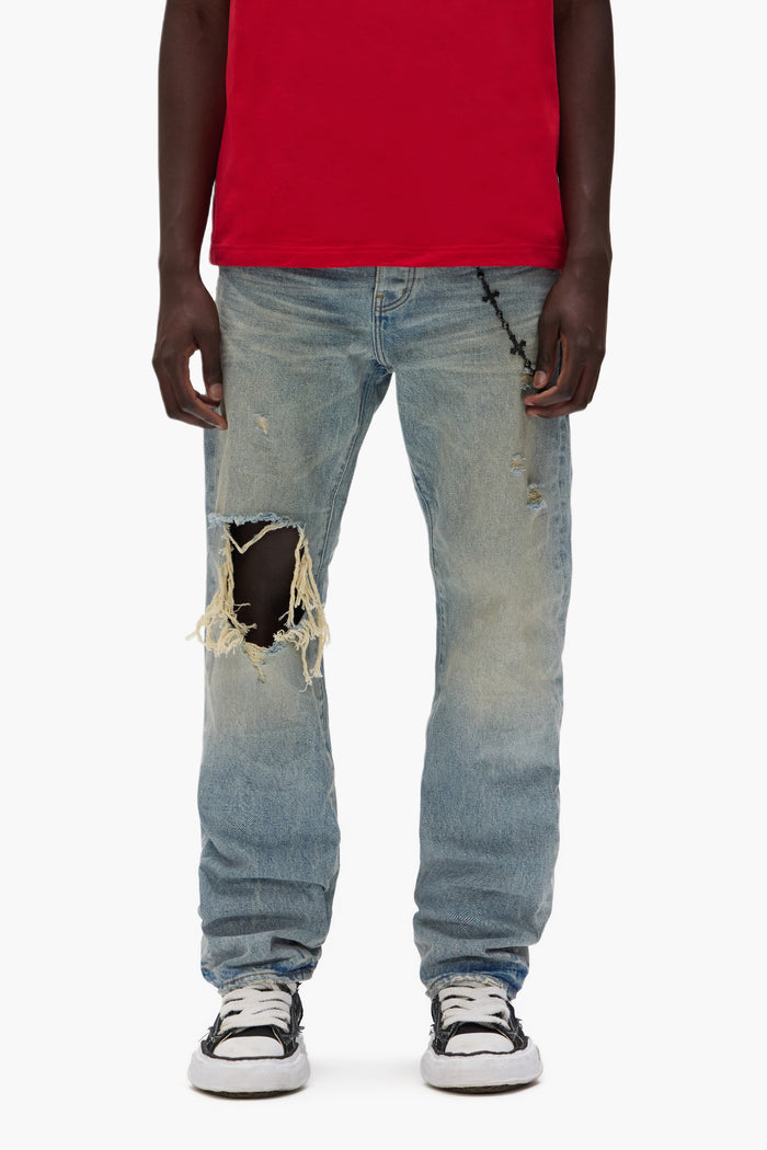 P011 Knee Blowout mid-rise men’s jeans in dirty light indigo wash with large knee tear.