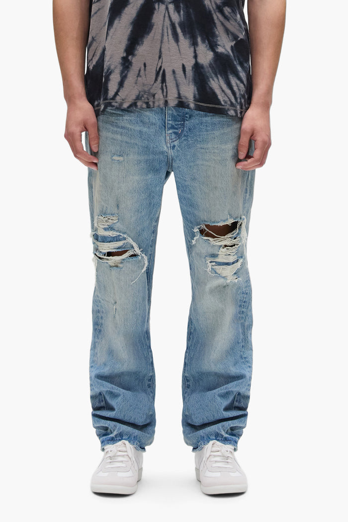P011 Knee Blowout denim in light indigo with front knee blowouts and contrast top stitching.