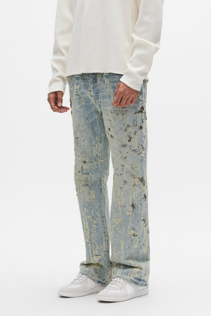 Bootcut denim jeans with beaded embellishments and all-over destroy detail.