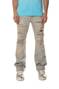 P026 Destroy Repair mid-rise bootcut denim with rips and repairs, size 33.