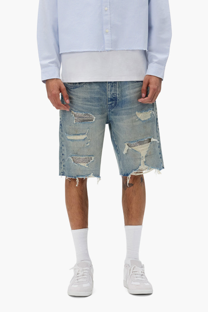 P059 Beaded Destroyed Short with raw edge hem, rips, and beaded patches in various sizes