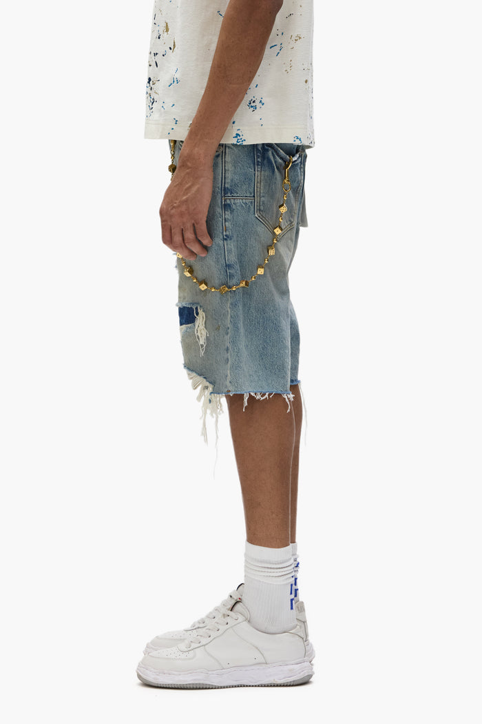 P059 Distressed Patch Shorts in light indigo wash with frayed hems and five-pocket design