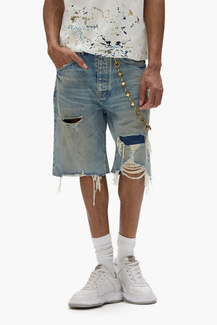 Distressed Patch Shorts with frayed hems and five-pocket construction in light indigo wash.