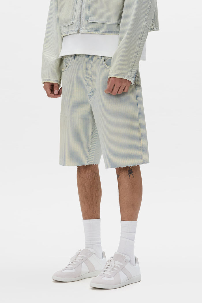 Hickory Short with relaxed fit, five-pocket styling, and raw cut off hem.