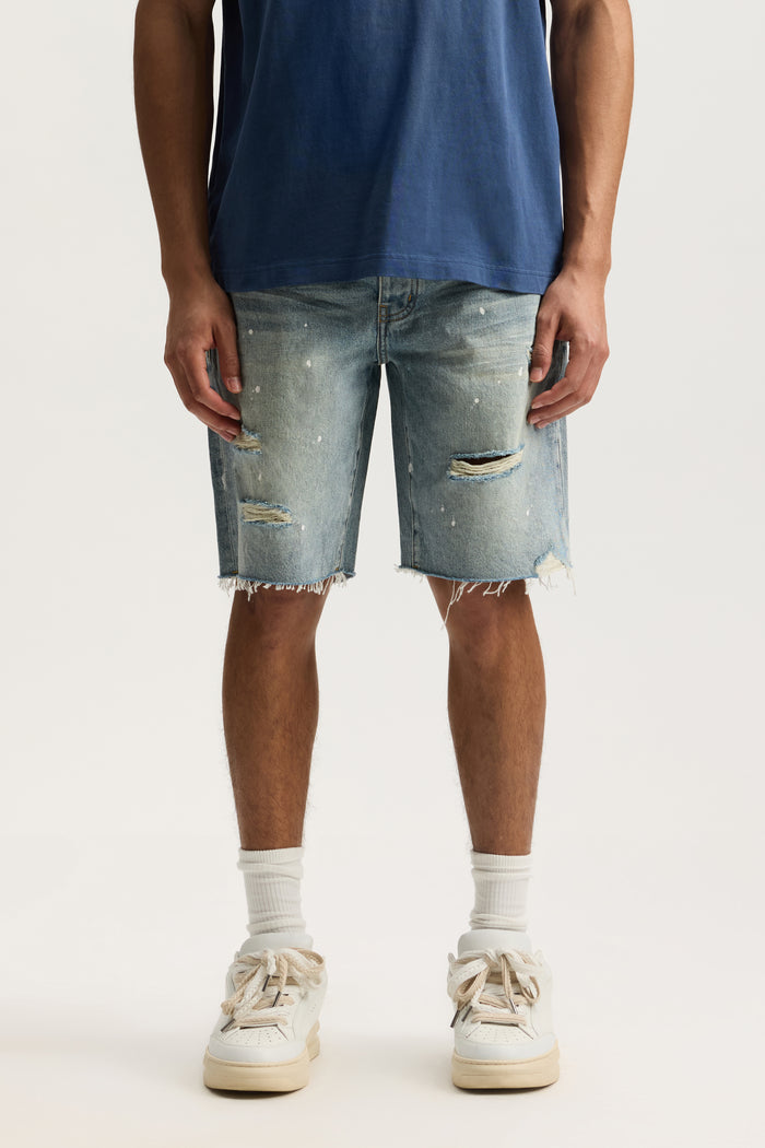 P059 Painterly Rip Short with vintage wash, relaxed fit, and raw hem, available in sizes 28-40.