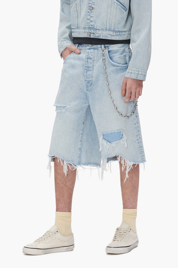 Blowout Patched Short with raw cut hem, 100% cotton, available in sizes 28 to 40.