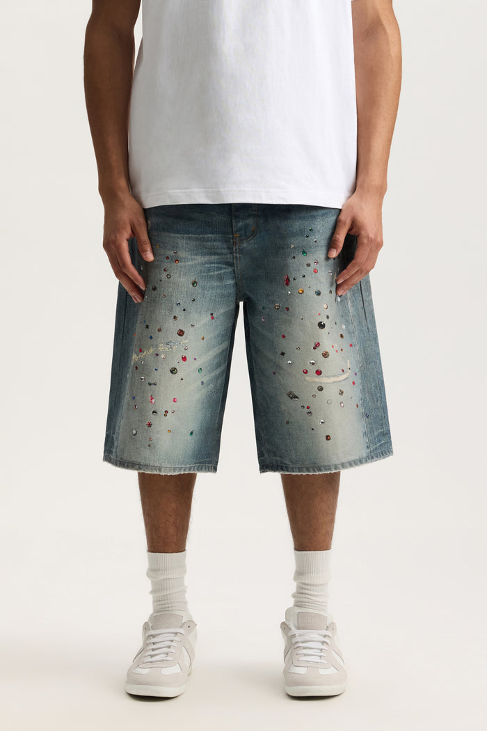 P070 Jewel Long Shorts with digital denim print, wide leg, and raw hem in various sizes.