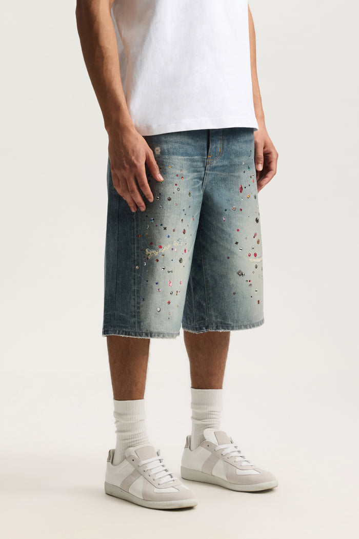 P070 Jewel Long Shorts with digital denim print, wide leg design, and raw hem.