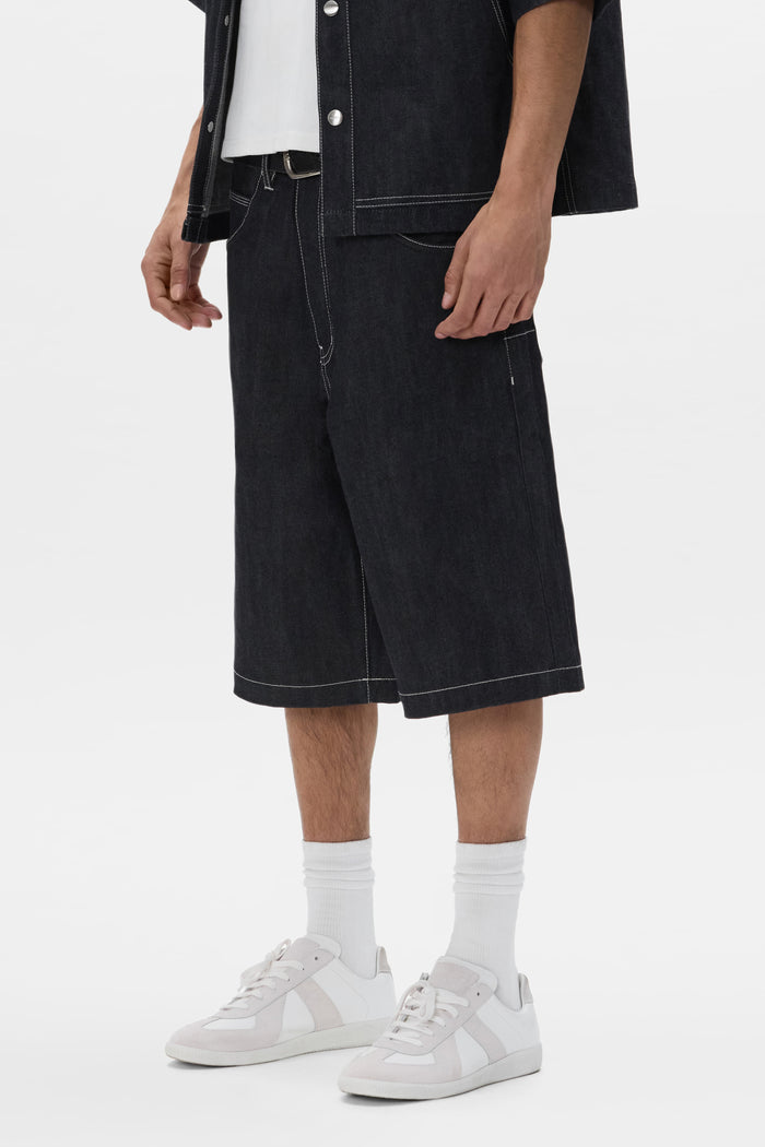 P070 Raw Shorts in dark indigo, 100% cotton, featuring wide leg and 5 pocket styling.