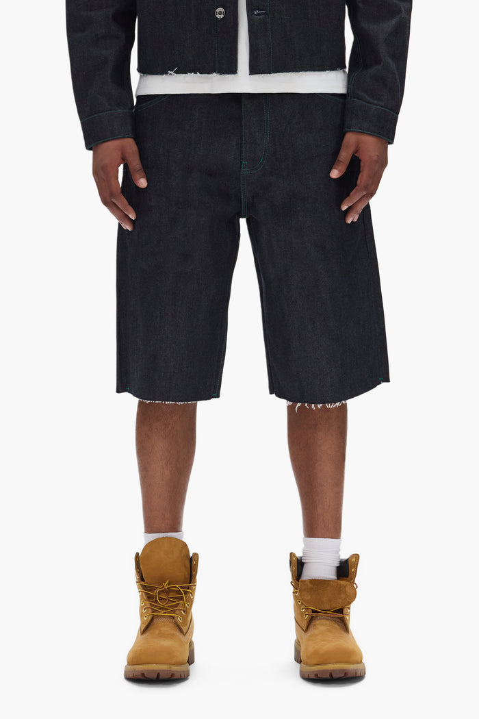 Clean Dark Indigo P070 Raw Shorts with wide leg, raw cut hem, and reinforced belt loops.