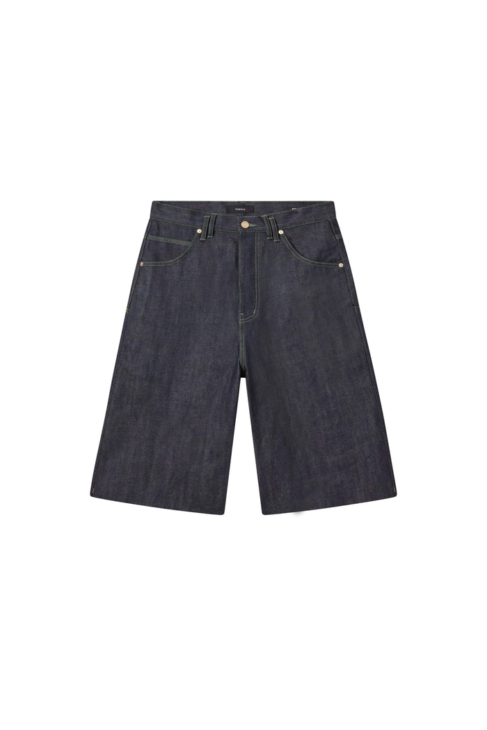 P070 Raw Shorts in Clean Dark Indigo with wide leg and raw cut hem, available in multiple sizes.