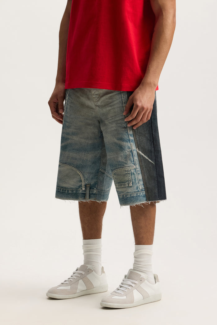P070 Upside Down Short with wide leg, reinforced belt loops, and raw cut off hem, available in sizes 28-40.