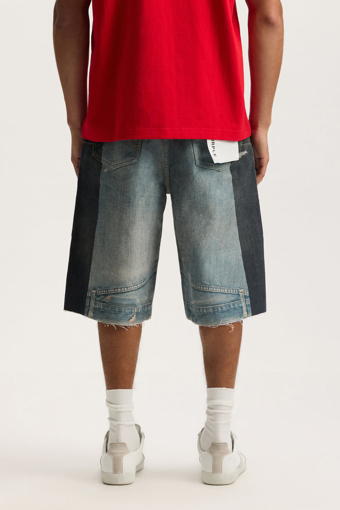 P070 Upside Down Short in wide leg style with raw cut off hem and button fly, available in sizes 28-40.