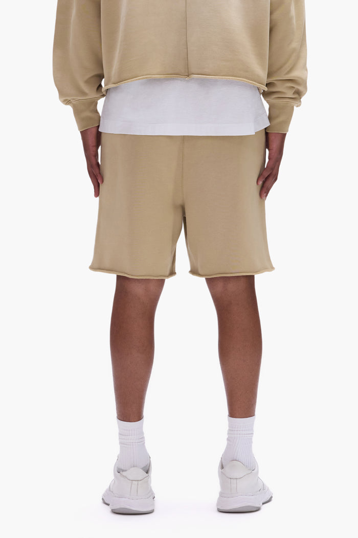 Painted Wordmark Shorts in Beige with screen printed logo and relaxed fit design