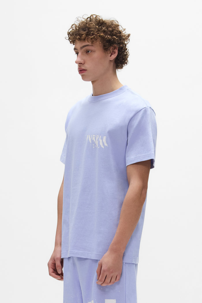 Painted Wordmark Tee in lavender, made of 100% cotton, featuring a screen printed design.