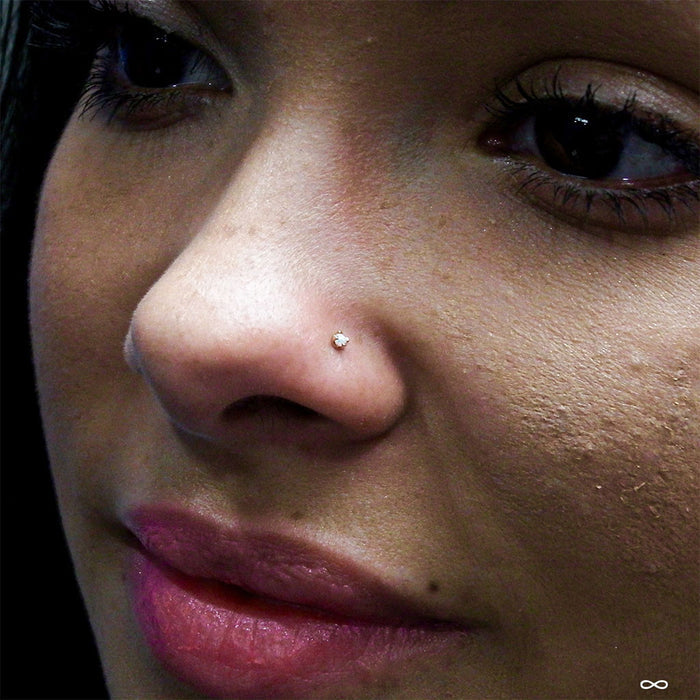 Nostril piercing with Prong-set Opal Press-fit End in Gold from LeRoi in 2mm white opal