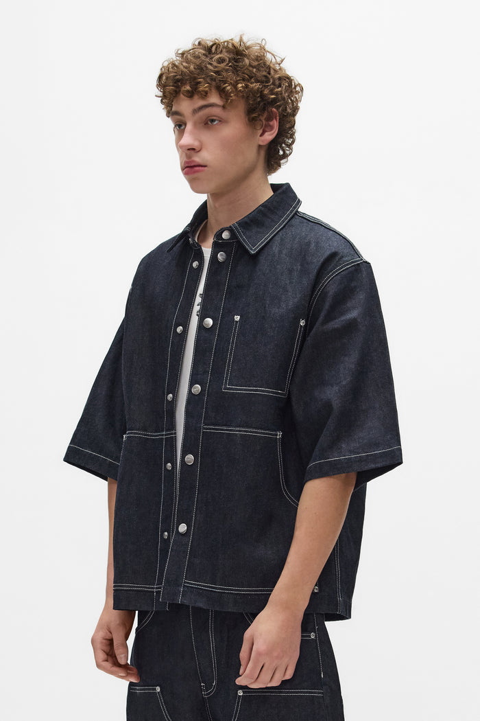 Raw Workwear Shirt in Raw Indigo, oversized fit, cropped length, snap front closure.