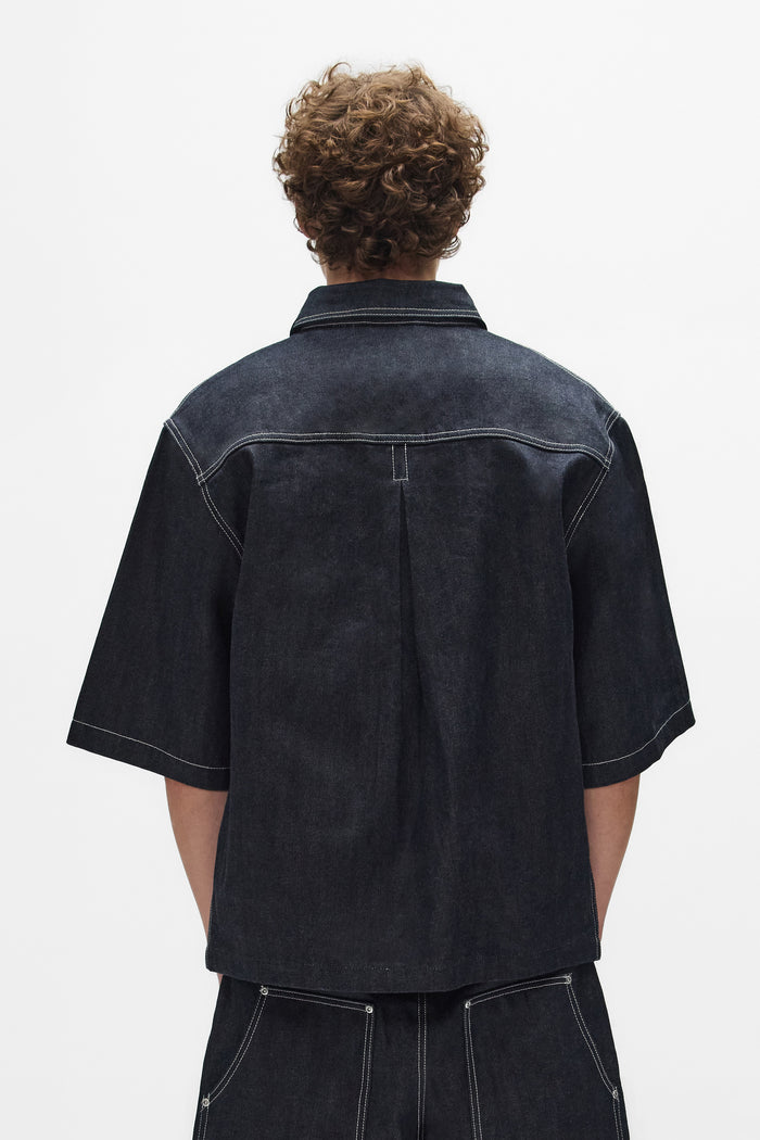 Raw Workwear Shirt in Raw Indigo, oversized fit, cropped length, snap front closure.