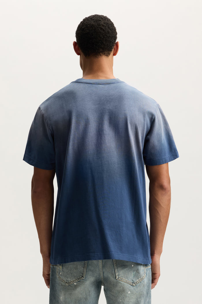Slanted Script Tee in faded wash with crackle print, available in sizes XS to 3XL.