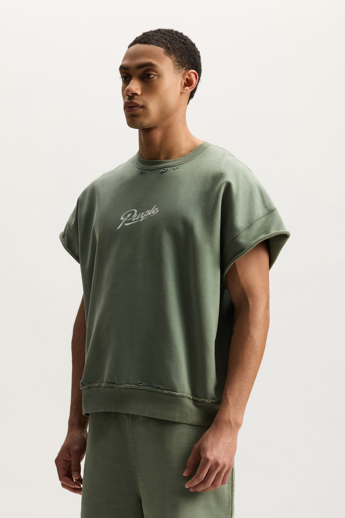 Slugger Script Muscle Tee in Mid Acid Wash with relaxed fit, raw edges, and short sleeves.