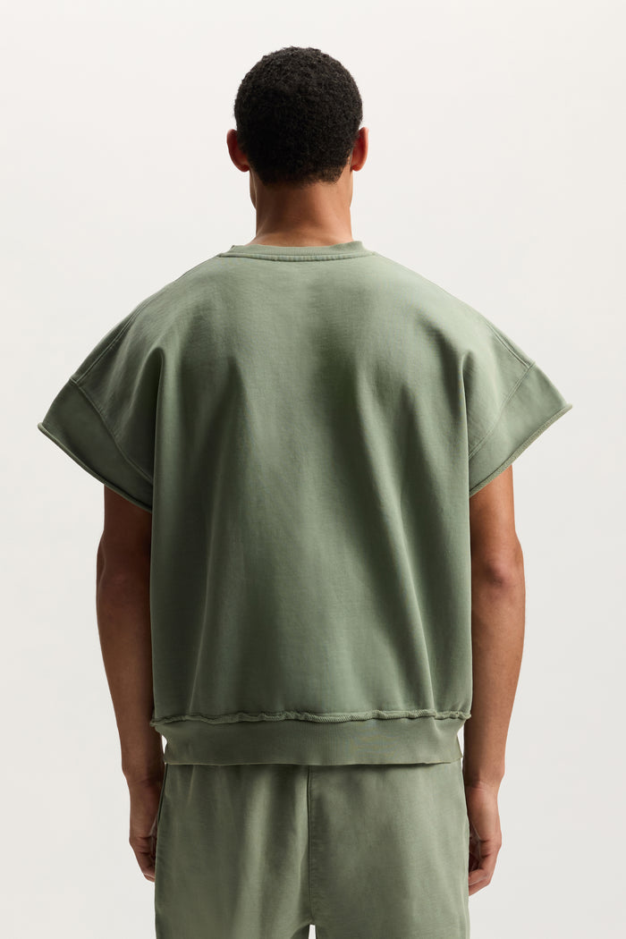 Slugger Script Muscle Tee in mid acid wash with relaxed fit and round neckline.
