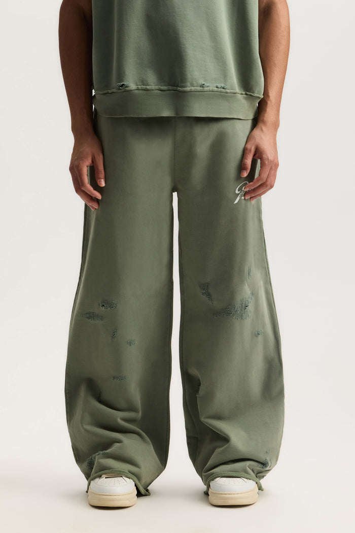 Slugger Script Sweatpant in mid acid wash with wide fit and elastic waistband.