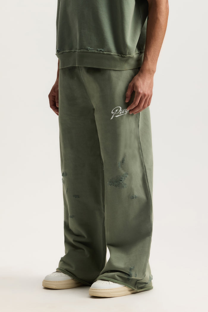 Slugger Script Sweatpant in mid acid wash with wide fit and elastic waistband.